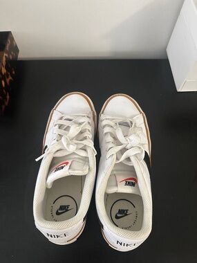 Nike White Low-Top Sneakers with Black Swoosh and Brown Trim